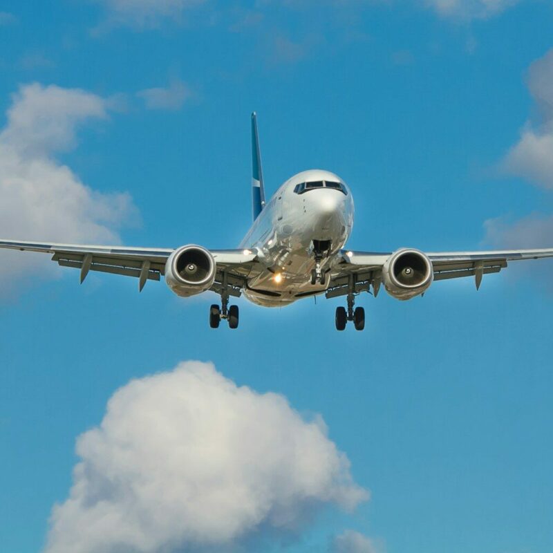 white airplane on mid air